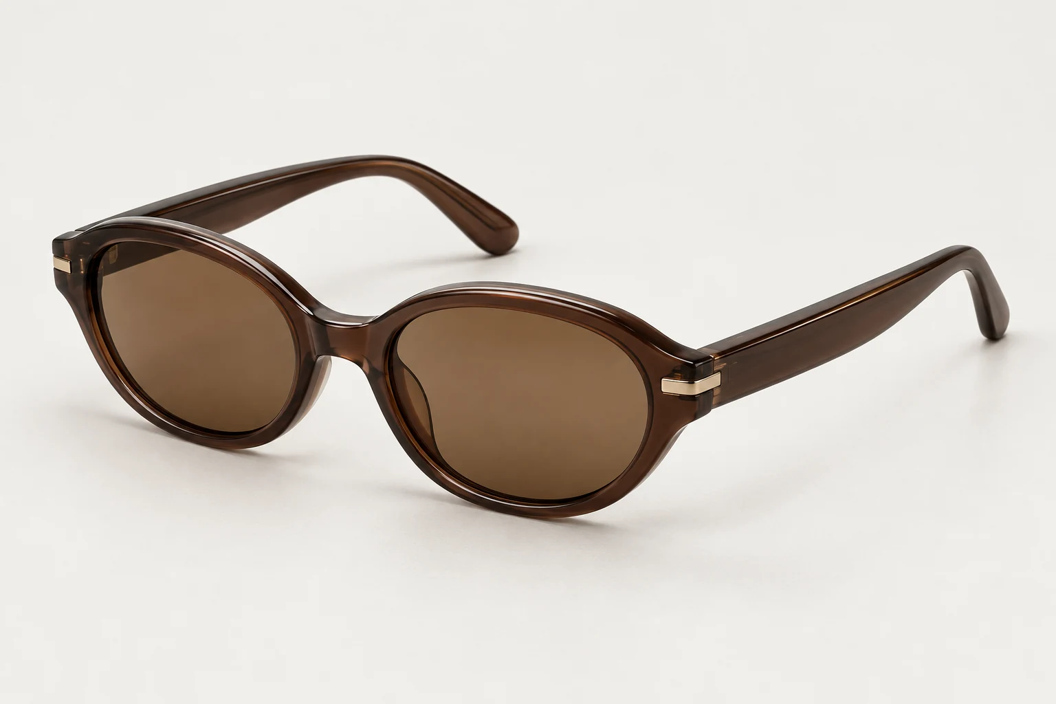 Linea, slim espresso oval sunglasses with earth lenses